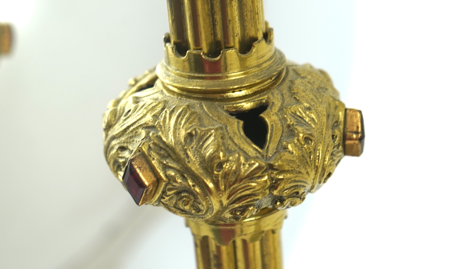 A set of four Gothic revival brass altar candlesticks